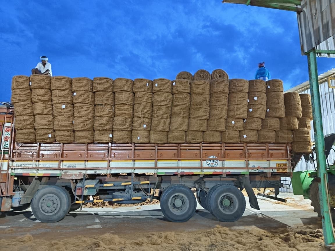Coiled coir rope bundles stacked and strapped onto a lorry for despatch